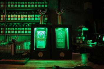 Jagermeister and Jagermeister Cold Brew Coffee lit by Green LEDs in display case on bar