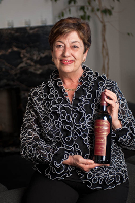 Maria Martinez-Sierra holding bottle of wine